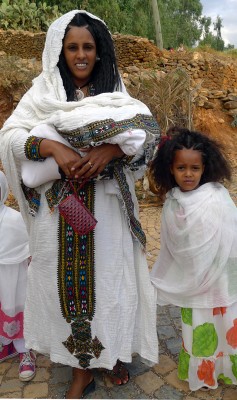 Mother and children dressed for the Festival