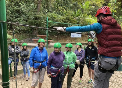 Judy getting instructions on the first of the seven ziplines at Monteverde.