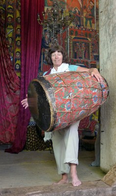 Judy, trying her hands at the monastery drum 
