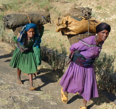 Ladies carry home their produce