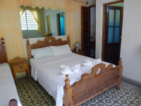 A typical casa bedroom with attached bathroom, Cuba