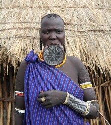 The Mursi tribe women wear clay disks  in their lower lip, Omo Valley 