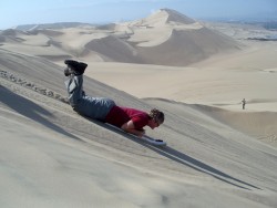 Sand boarding at the Huacachina Dunes,  Peru